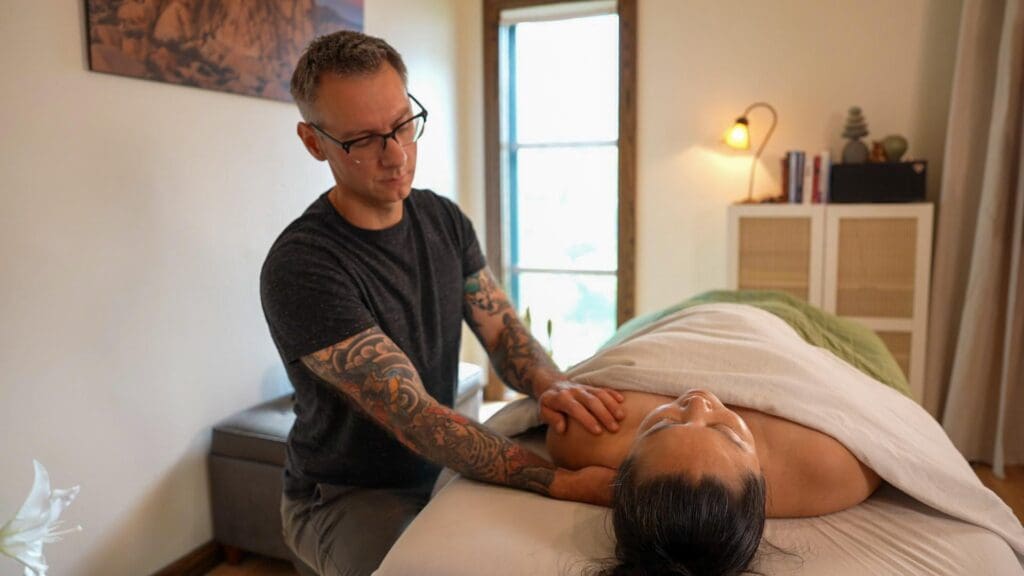 Professional wellness practitioner using CBD topicals